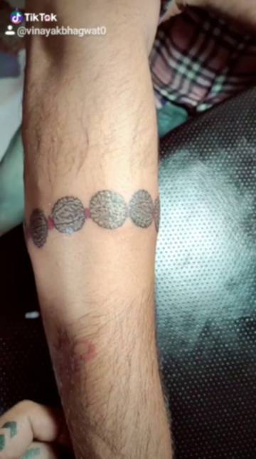 Om with rudraksh mala tattoo designed and tattooed by Mokshats  Artmotion  Finger tattoo for women Small tattoos for guys Hand tattoos  for women