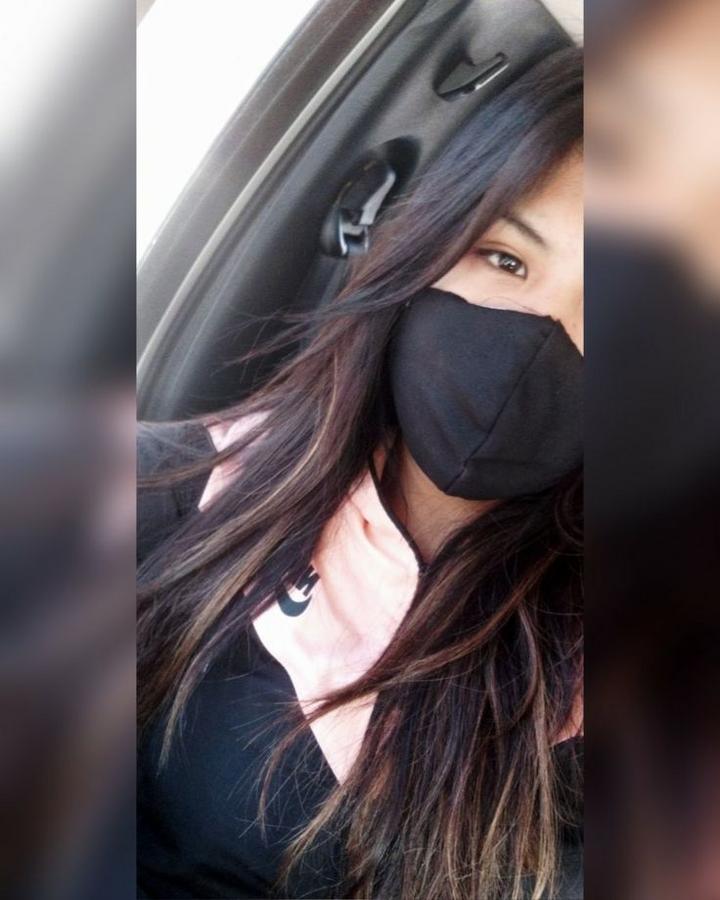 girl hiding face with mask